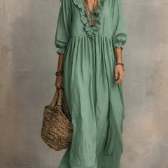 Gray Elowen boho long sleeve maxi dress by THE WHITMORE FAMILY, featuring flowing fabric and bohemian style.