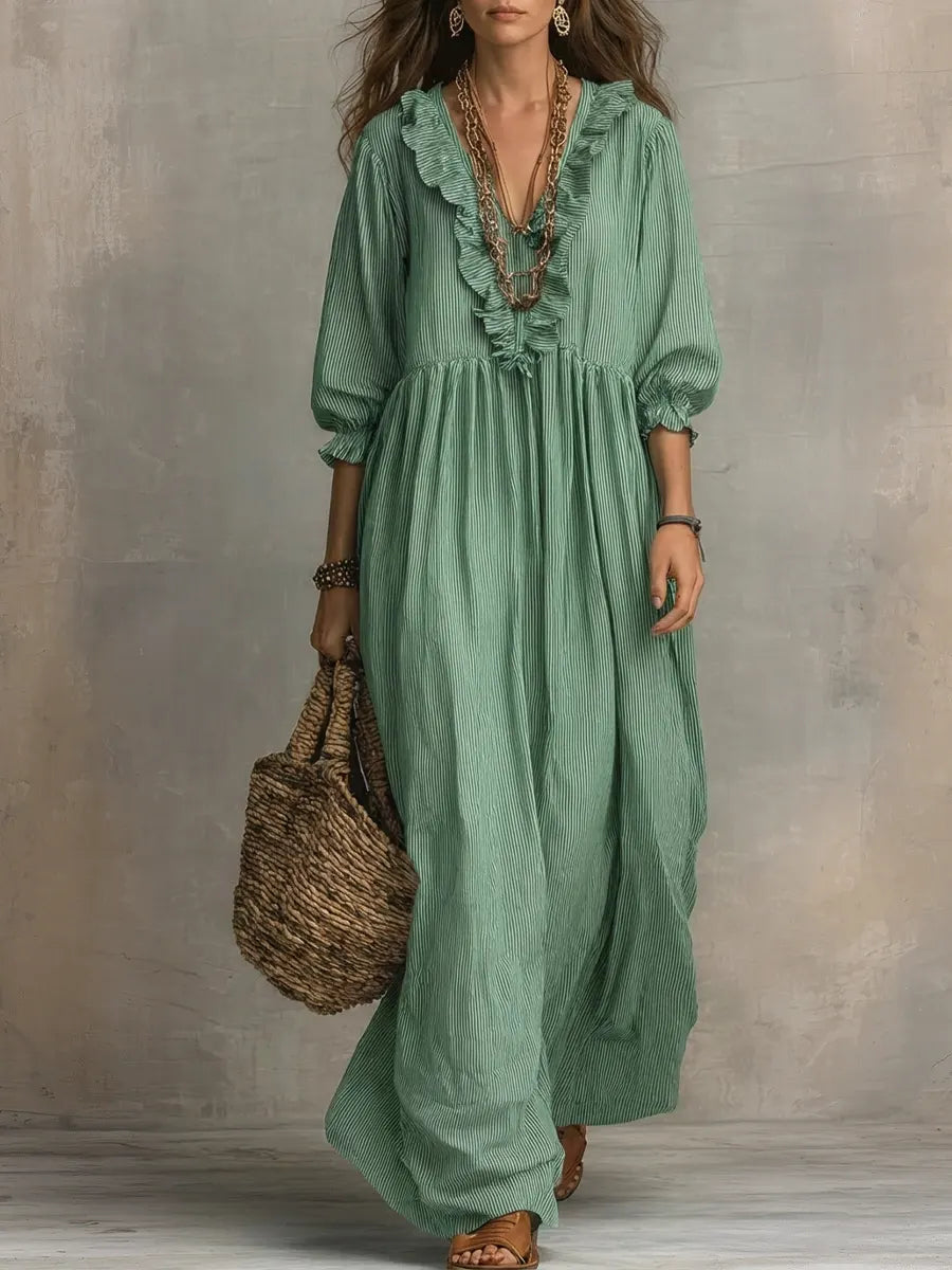 Gray Elowen boho long sleeve maxi dress by THE WHITMORE FAMILY, featuring flowing fabric and bohemian style.