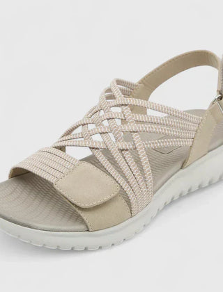 Green Arvienne™ orthopedic sandals by THE WHITMORE FAMILY with cushioned straps and supportive sole, designed for comfort and style.