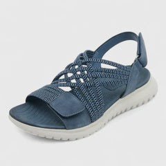 Green Arvienne™ orthopedic sandals by THE WHITMORE FAMILY with supportive straps and cushioned soles for comfort.