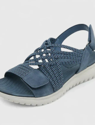 Green Arvienne™ orthopedic sandals by THE WHITMORE FAMILY with supportive straps and cushioned soles for comfort.
