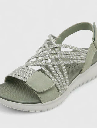Green Arvienne™ orthopedic sandals by THE WHITMORE FAMILY featuring supportive footbed and adjustable straps.