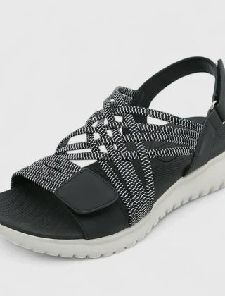 Green Arvienne™ orthopedic sandals by THE WHITMORE FAMILY with cushioned straps and supportive soles for comfortable wear.
