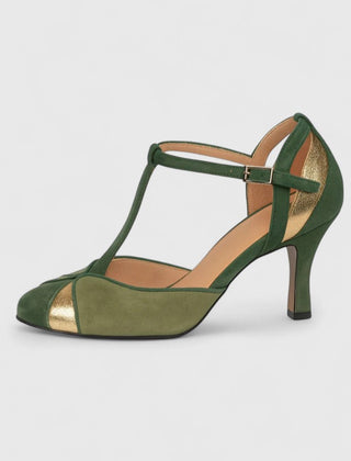 Green Coralise sophisticated heels by THE WHITMORE FAMILY featuring a sleek design and pointed toe on a stylish model.