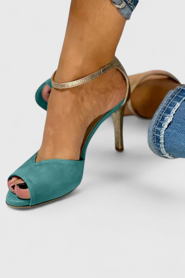 Green Nolavie elegant heels by THE WHITMORE FAMILY, showcasing stylish pointed toes and sleek design.