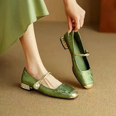 Green Mestelle Elegant Mary Janes by THE WHITMORE FAMILY featuring classic strap design and stylish leather finish.