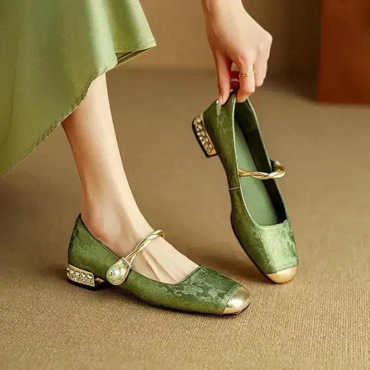 Green Mestelle Elegant Mary Janes by THE WHITMORE FAMILY featuring classic strap design and stylish leather finish.