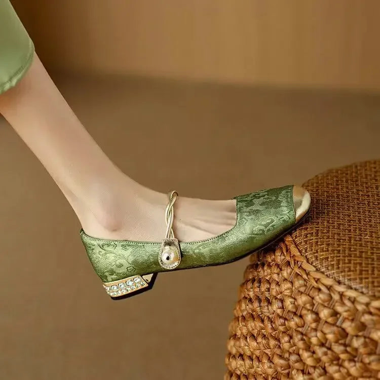Green Mestelle Elegant Mary Janes by THE WHITMORE FAMILY featuring a classic strap and polished leather finish.