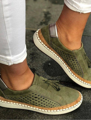 Green Arden™ Orthoflex slip-ons by THE WHITMORE FAMILY, shown in a close-up view of the comfortable, casual footwear.