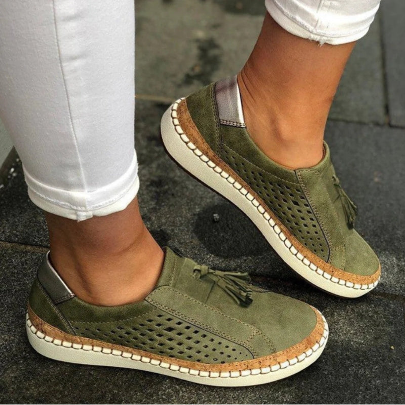 Green Arden™ Orthoflex slip-ons by THE WHITMORE FAMILY, shown in a close-up view of the comfortable, casual footwear.