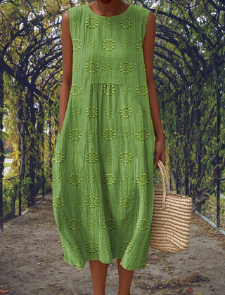 Green Aikaterini sleeveless dress by THE WHITMORE FAMILY with elegant design and practical pockets.