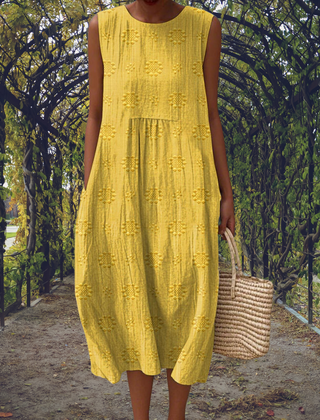 Green Aikaterini sleeveless dress with pockets by THE WHITMORE FAMILY, featuring a stylish and elegant design.