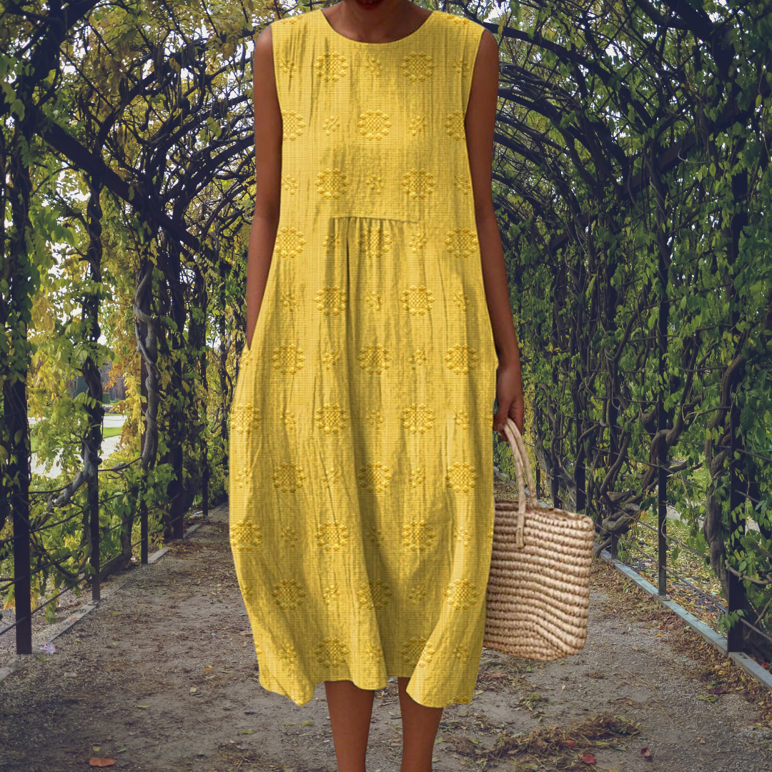 Green Aikaterini sleeveless dress with pockets by THE WHITMORE FAMILY, featuring a stylish and elegant design.