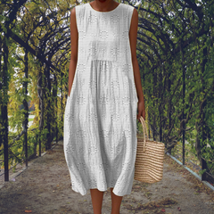 Green Aikaterini elegant sleeveless dress with pockets by THE WHITMORE FAMILY, shown on a model with a fitted silhouette.