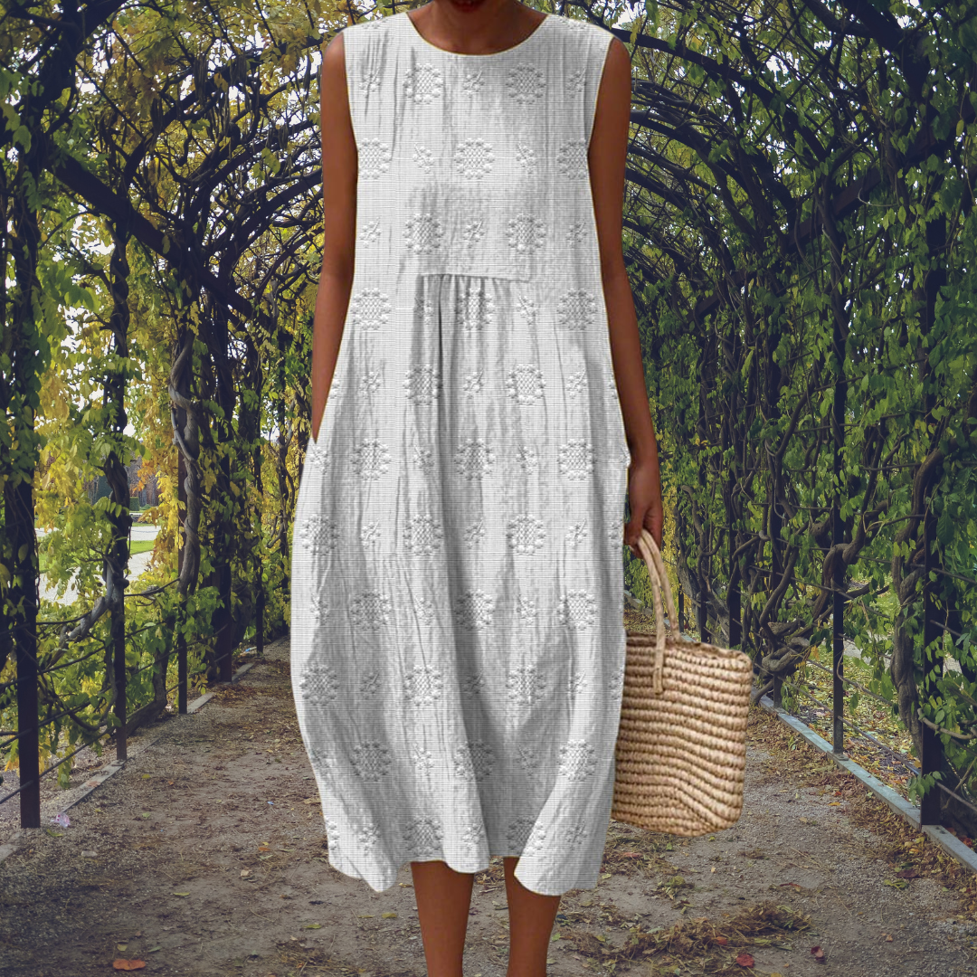 Green Aikaterini elegant sleeveless dress with pockets by THE WHITMORE FAMILY, shown on a model with a fitted silhouette.