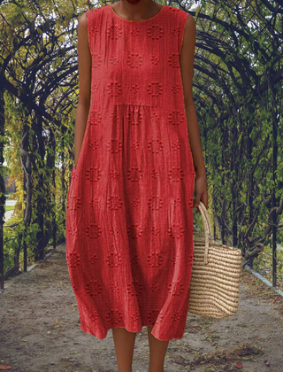 Green Aikaterini sleeveless dress with pockets by THE WHITMORE FAMILY, featuring a stylish and elegant design.