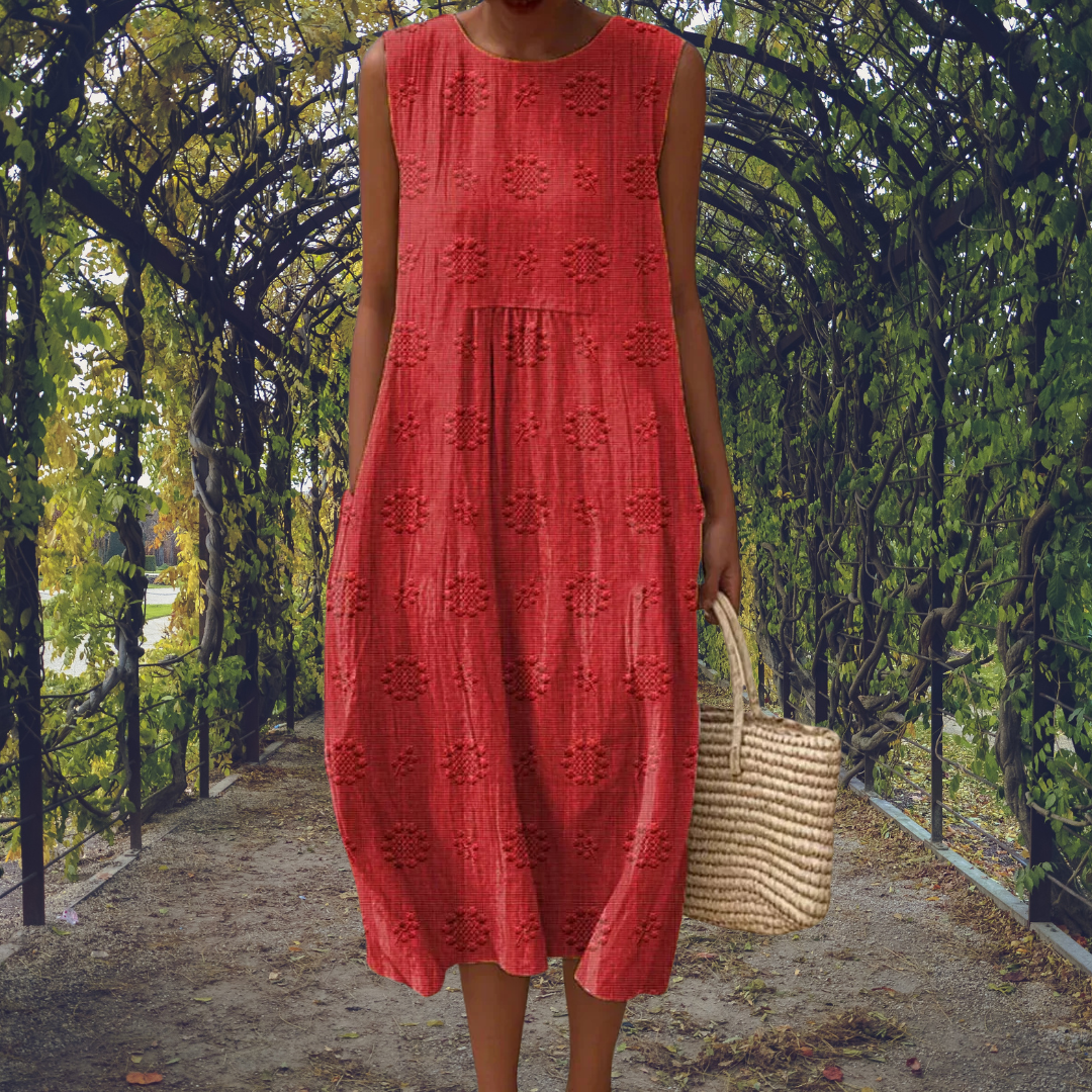 Green Aikaterini sleeveless dress with pockets by THE WHITMORE FAMILY, featuring a stylish and elegant design.
