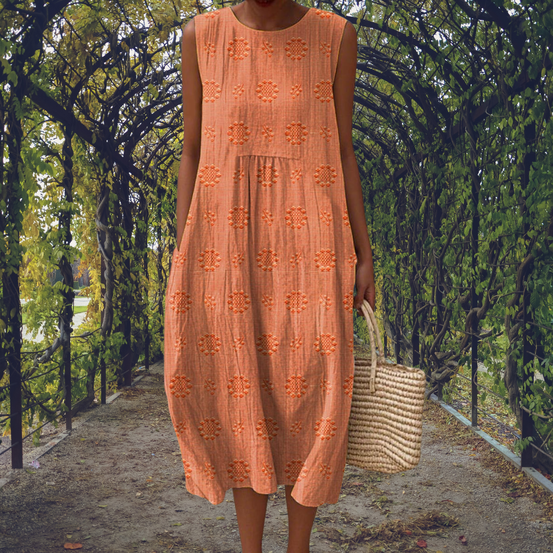 Green Aikaterini sleeveless dress with pockets by THE WHITMORE FAMILY, featuring a stylish and elegant design.