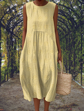 Green Aikaterini sleeveless dress with pockets by THE WHITMORE FAMILY, featuring a fitted silhouette and stylish design.