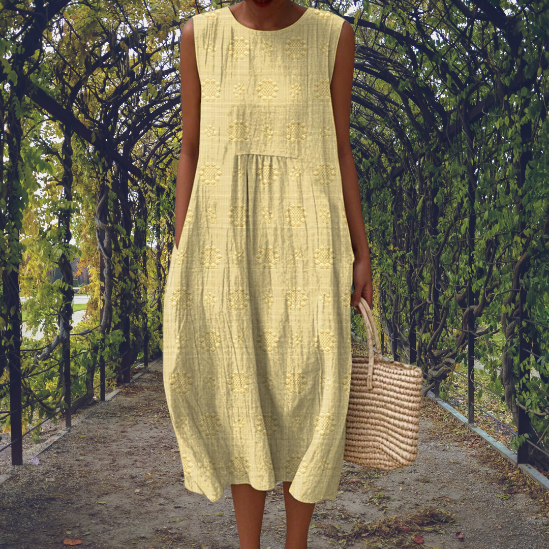 Green Aikaterini sleeveless dress with pockets by THE WHITMORE FAMILY, featuring a fitted silhouette and stylish design.
