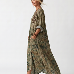 Green Aleta Button Front Oversized Pocket Midi Dress by THE WHITMORE FAMILY, featuring a relaxed fit and front pockets.