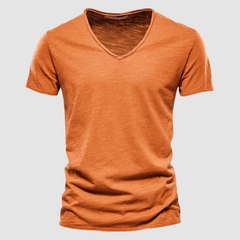 Green Burnet™ Cotton Summer Tee by THE WHITMORE FAMILY displayed on a model, showcasing a casual, lightweight t-shirt for warm weather.