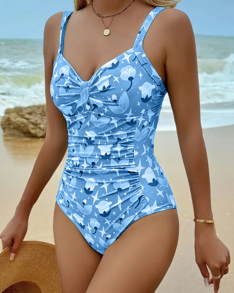 Green Clara™ printed tankini by THE WHITMORE FAMILY featuring a stylish one-piece design with vibrant floral print.