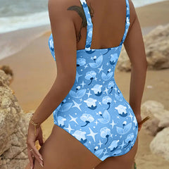 Green Clara™ printed tankini from THE WHITMORE FAMILY featuring a stylish one-piece design with vibrant print details.