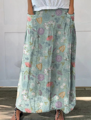 Green Daisy™ Blooming Spring floral and bumble bee pattern printed pocket skirt by THE WHITMORE FAMILY, with floral and bee design.