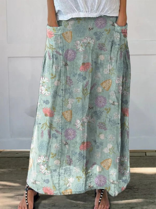Green Daisy™ Blooming Spring floral and bumble bee pattern printed pocket skirt by THE WHITMORE FAMILY, with floral and bee design.