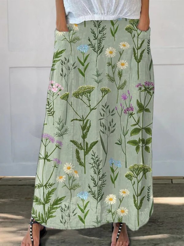 Gerlin™ printed pocket skirt by THE WHITMORE FAMILY featuring an enriched spring field repeat pattern in vibrant green.