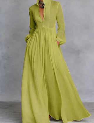 Green Patricia flowing maxi dress by THE WHITMORE FAMILY with button-front design and lightweight, elegant fabric.