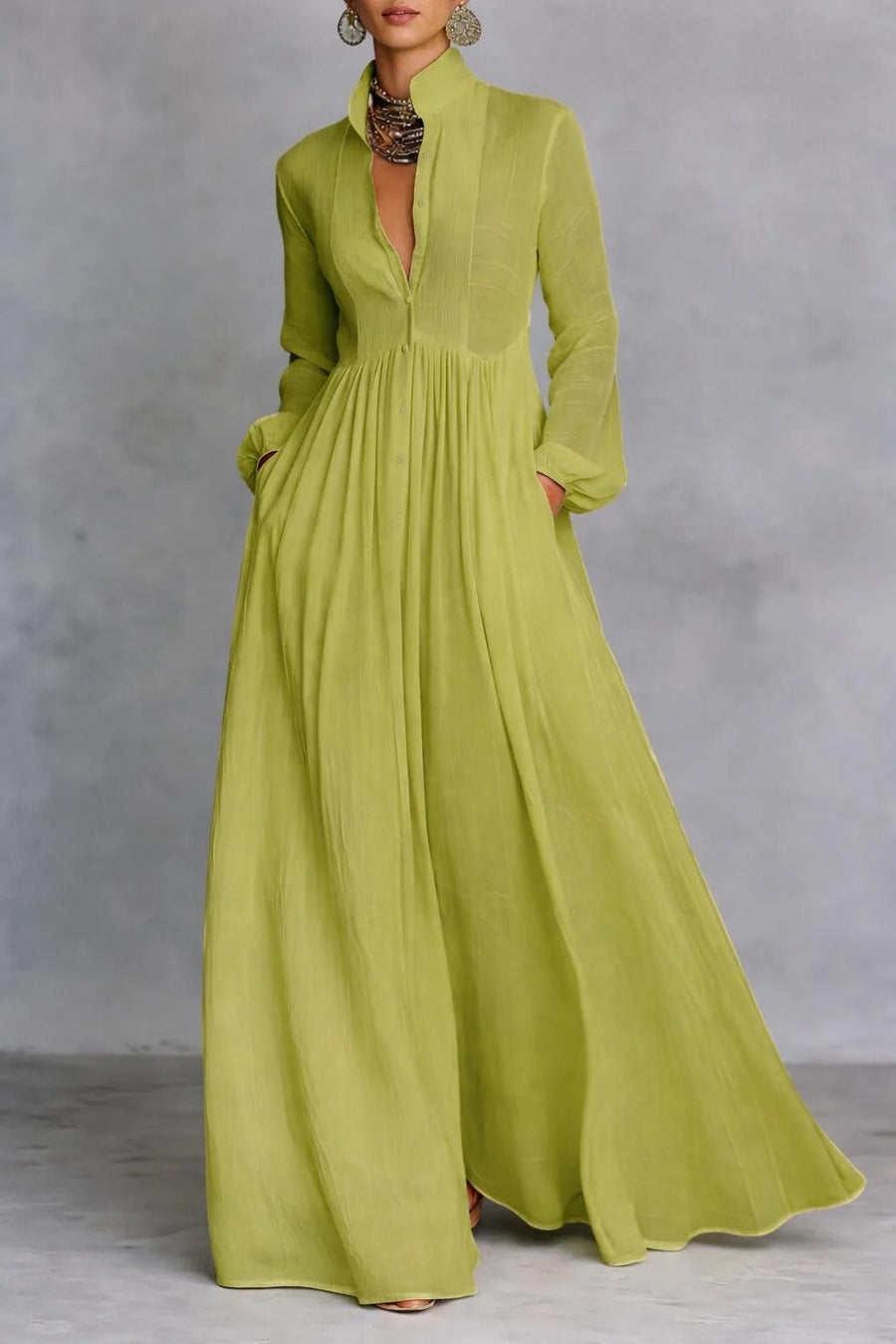 Green Patricia flowing maxi dress by THE WHITMORE FAMILY with button-front design and lightweight, elegant fabric.
