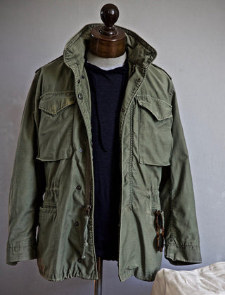 Scott™ Field Jacket by THE WHITMORE FAMILY, men's outdoor jacket in olive green with multiple pockets and durable fabric.