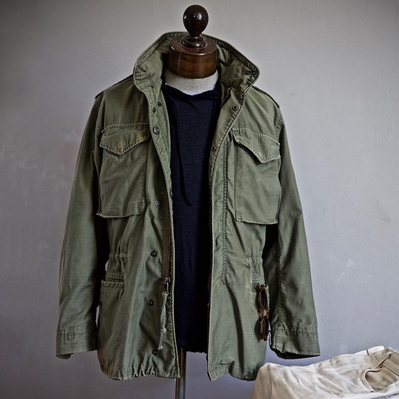 Scott™ Field Jacket by THE WHITMORE FAMILY, men's outdoor jacket in olive green with multiple pockets and durable fabric.