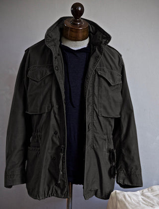 Scott™ Field Jacket by THE WHITMORE FAMILY, olive green outdoor jacket with multiple pockets and durable fabric.