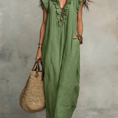 Green Sienna Boho Ruffle Maxi Dress by THE WHITMORE FAMILY, flowing fabric with ruffle details and relaxed bohemian style.