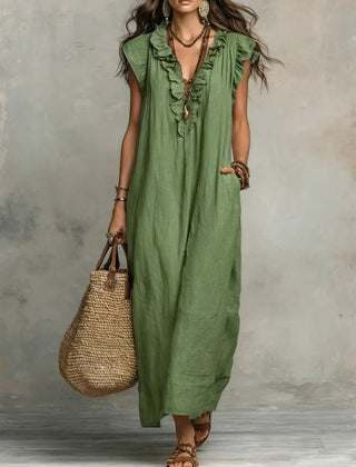 Green Sienna Boho Ruffle Maxi Dress by THE WHITMORE FAMILY, flowing fabric with ruffle details and relaxed bohemian style.
