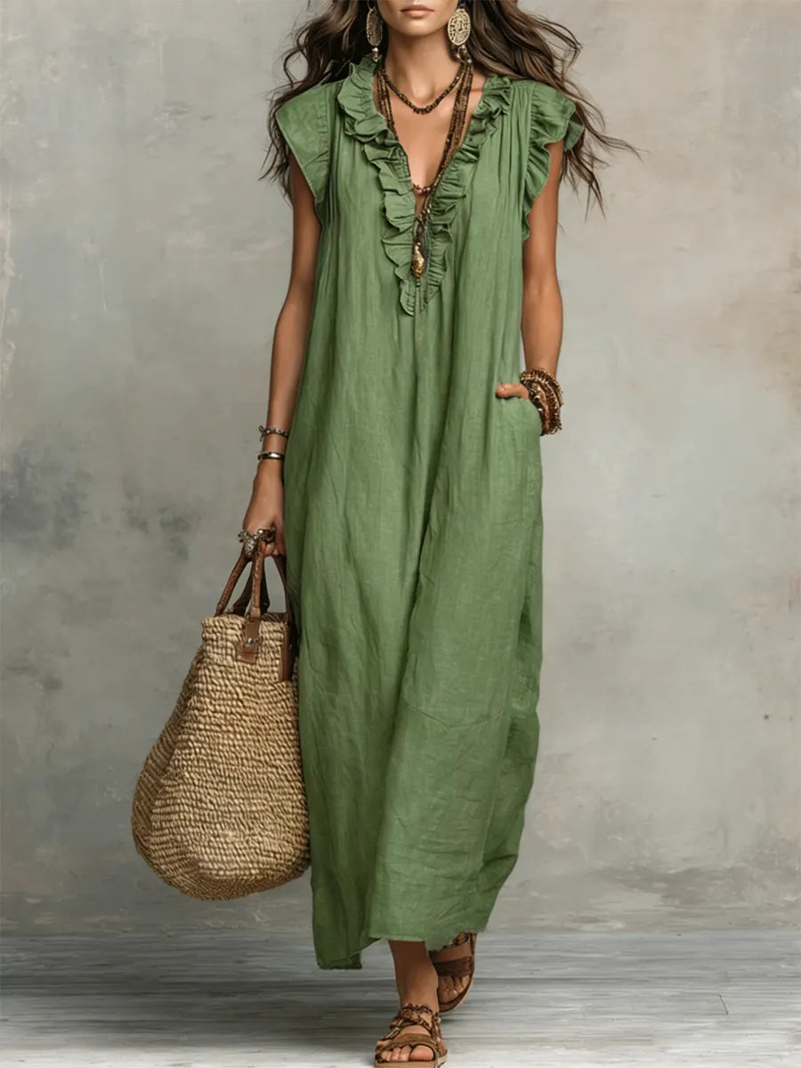 Green Sienna Boho Ruffle Maxi Dress by THE WHITMORE FAMILY, flowing fabric with ruffle details and relaxed bohemian style.