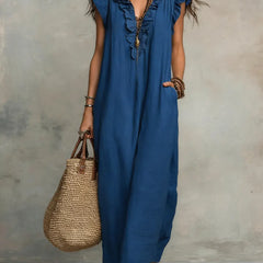 Green Sienna boho ruffle maxi dress by THE WHITMORE FAMILY, flowing fabric with layered ruffles and bohemian style.