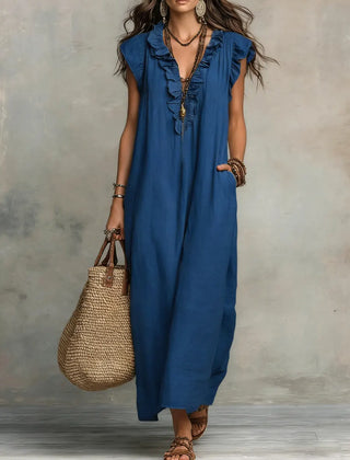 Green Sienna boho ruffle maxi dress by THE WHITMORE FAMILY, flowing fabric with layered ruffles and bohemian style.