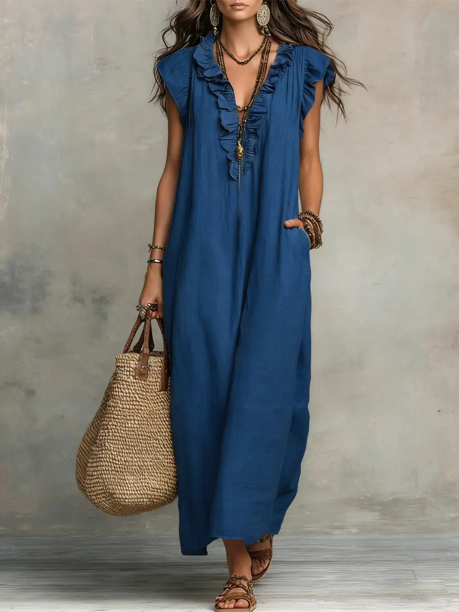 Green Sienna boho ruffle maxi dress by THE WHITMORE FAMILY, flowing fabric with layered ruffles and bohemian style.
