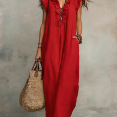 Green Sienna Boho Ruffle Maxi Dress by THE WHITMORE FAMILY, flowing fabric with ruffle details and bohemian style.