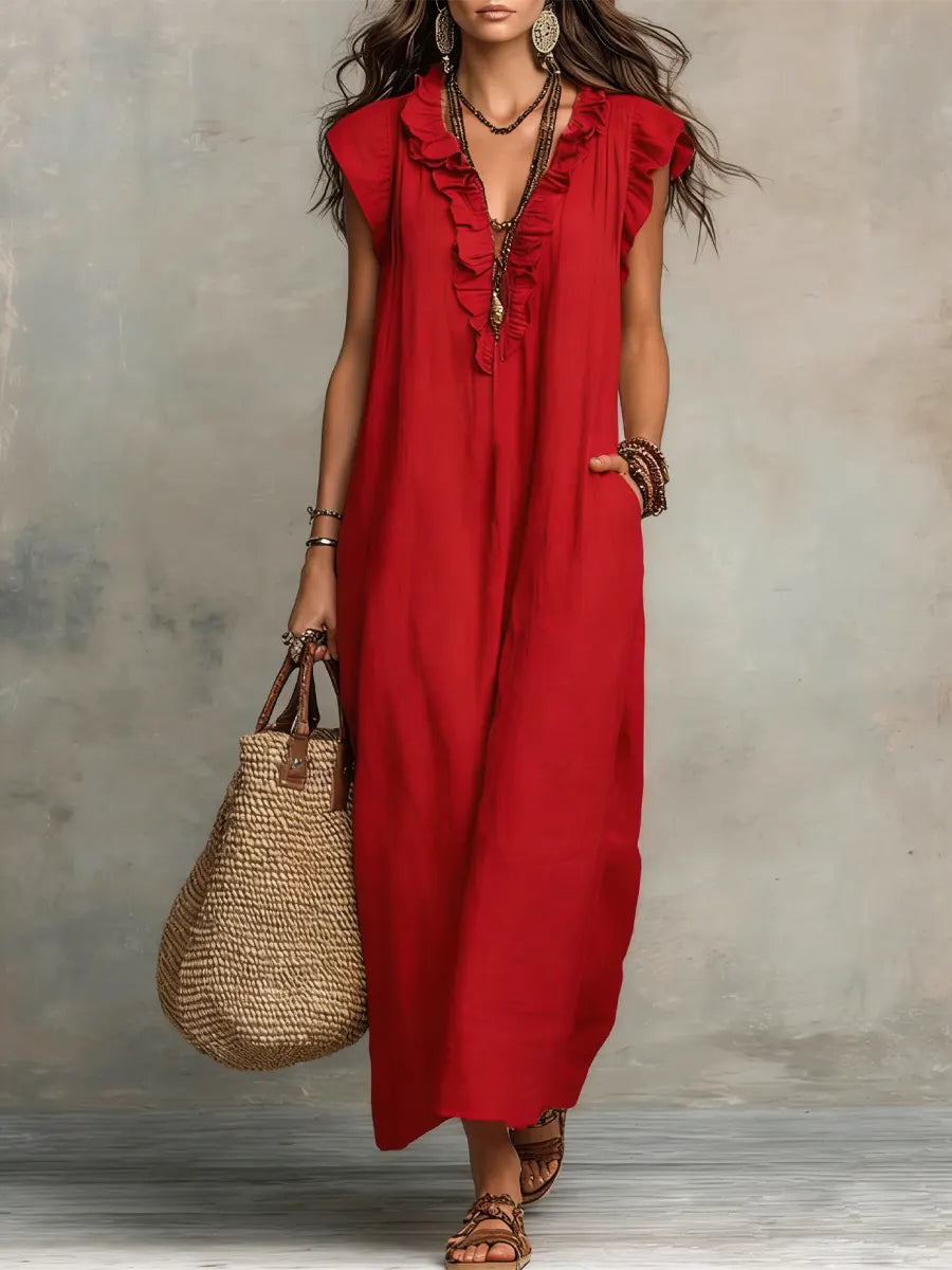 Green Sienna Boho Ruffle Maxi Dress by THE WHITMORE FAMILY, flowing fabric with ruffle details and bohemian style.