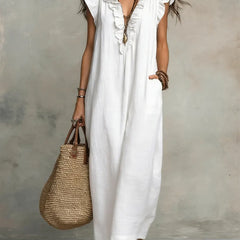 Green Sienna boho ruffle maxi dress by THE WHITMORE FAMILY, flowing fabric with ruffle details and a relaxed fit.