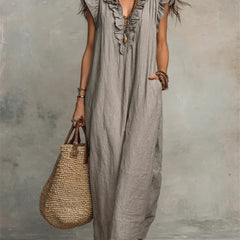 Green Sienna boho ruffle maxi dress by THE WHITMORE FAMILY, flowing fabric with layered ruffles and a relaxed bohemian style.