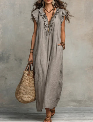 Green Sienna boho ruffle maxi dress by THE WHITMORE FAMILY, flowing fabric with layered ruffles and a relaxed bohemian style.