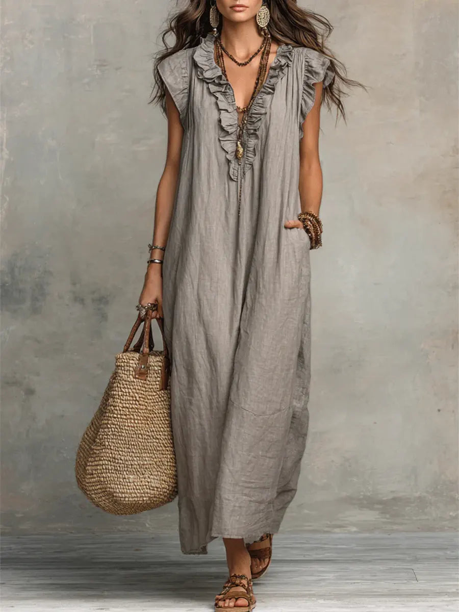 Green Sienna boho ruffle maxi dress by THE WHITMORE FAMILY, flowing fabric with layered ruffles and a relaxed bohemian style.