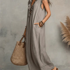 Green Sienna boho ruffle maxi dress by THE WHITMORE FAMILY, flowing fabric with layered ruffles and bohemian style.
