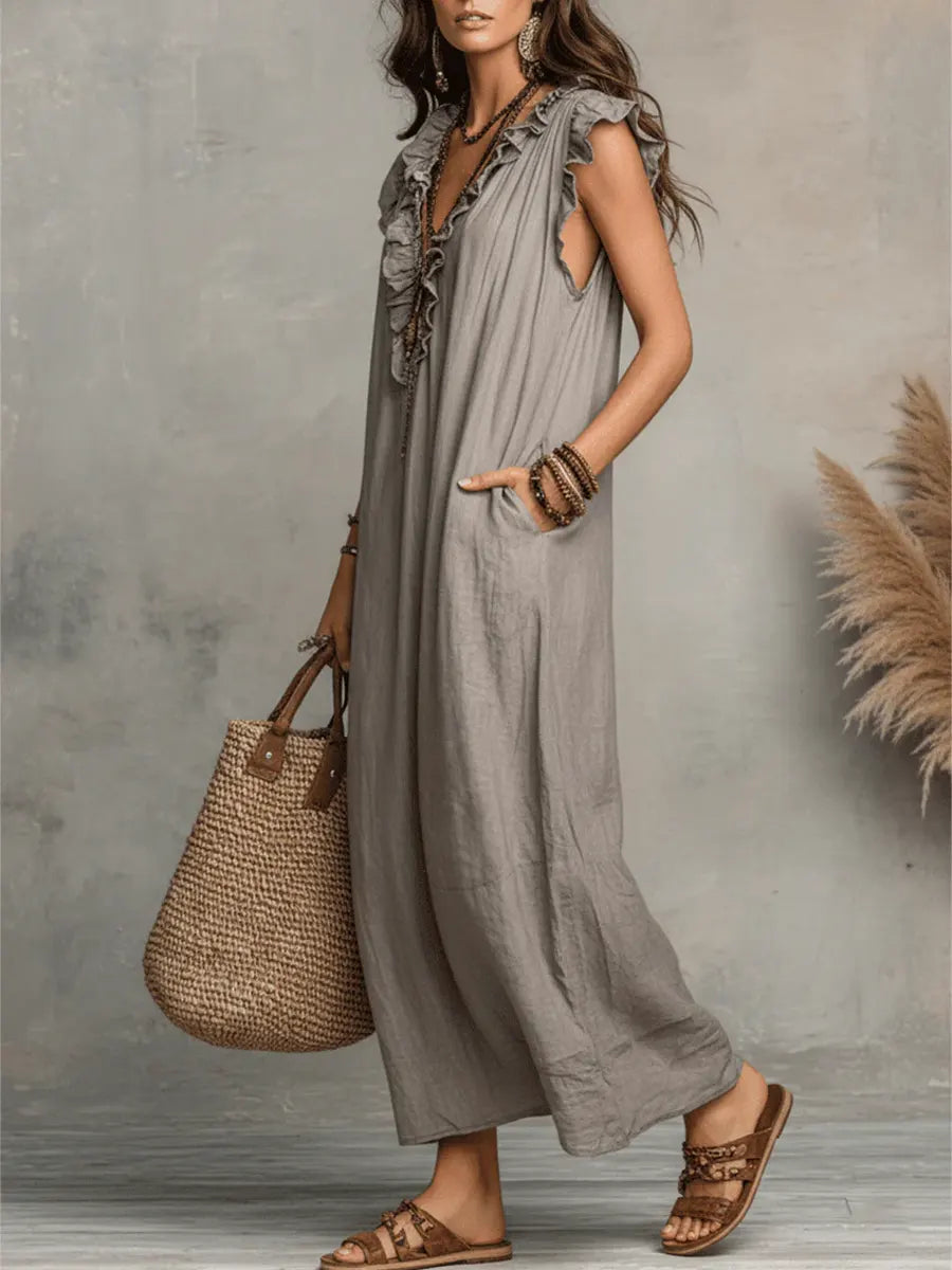 Green Sienna boho ruffle maxi dress by THE WHITMORE FAMILY, flowing fabric with layered ruffles and bohemian style.